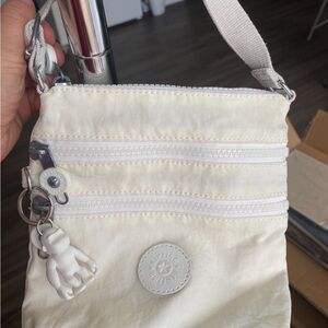KIPLING tiny cross-body purse.